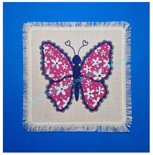 Pretty floral ditsy fabric Applique Butterfly machine embroidery design on a beige linen base fabric with a scalloped delicate lace border